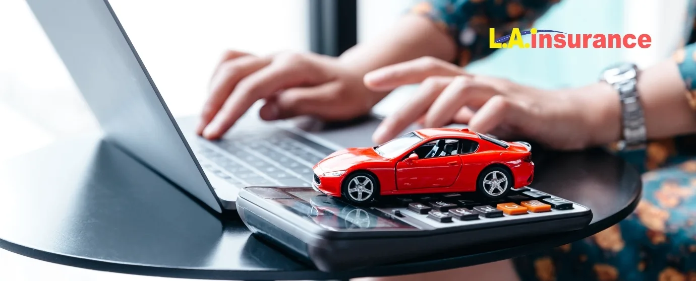 Can You Pause Car Insurance? Car insurance cost calculation with red car model on calculator and laptop